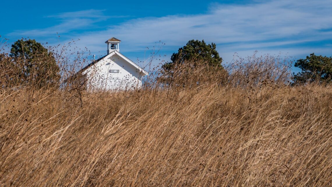 wooden tower house on dry grass field